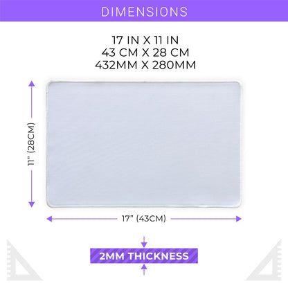 White 17x11 inch sublimation blank mat shown on a desk. Versatile surface works as a large mousepad, placemat, or small playmat. Smooth polyester top with black rubber backing, perfect for crafts, custom designs, and heat press printing. Ideal for personalized gifts, card games, or creative projects.