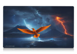 a beautiful orange bird resembling the iconic magic the gathering card Birds of Paradise. A volcano and lightning over a body of water in the background. 24 by 14 inch playmat art. bolt the bird!